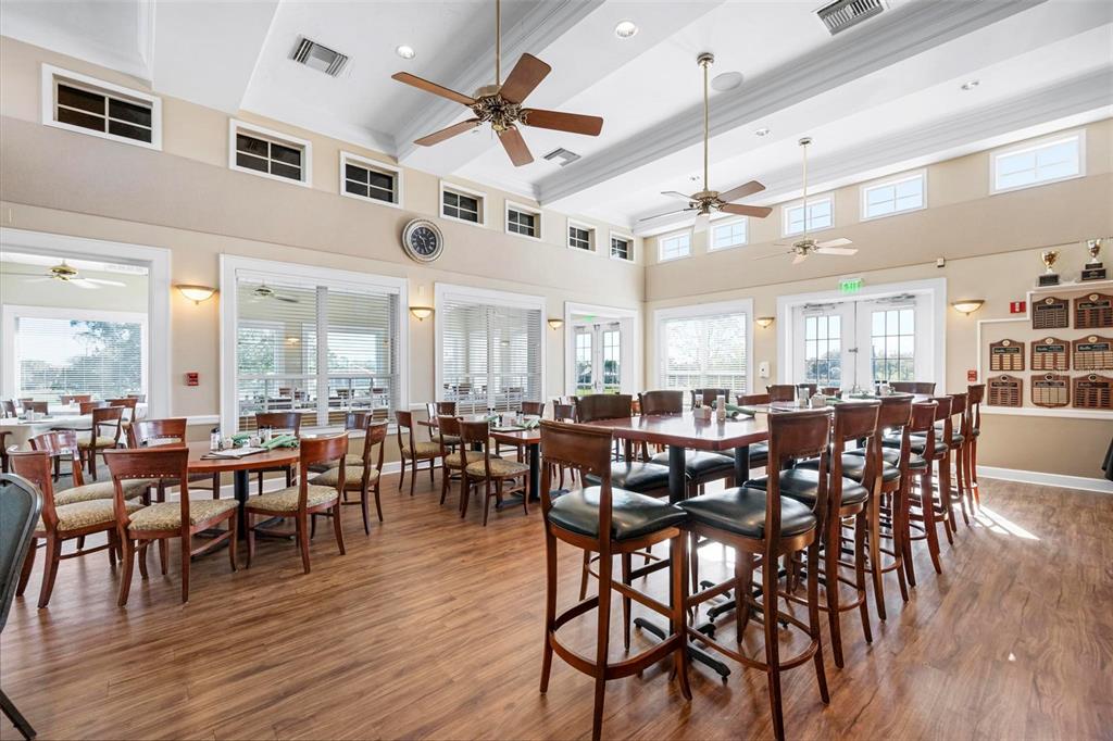 1807 San Trovaso Way Venice, FL 34285 - Photo 39 of 61 a view of a dining room with furniture window and wooden floor