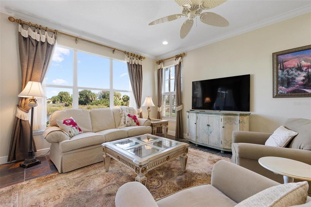 1807 San Trovaso Way Venice, FL 34285 - Photo 6 of 61 a living room with furniture and a flat screen tv