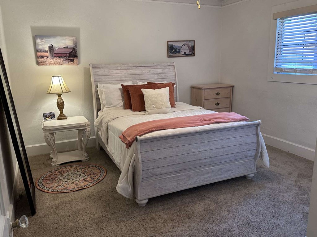 443 2nd Avenue Columbus, GA 31901 - Photo 7 of 20 a bed room with a bed and a night stand