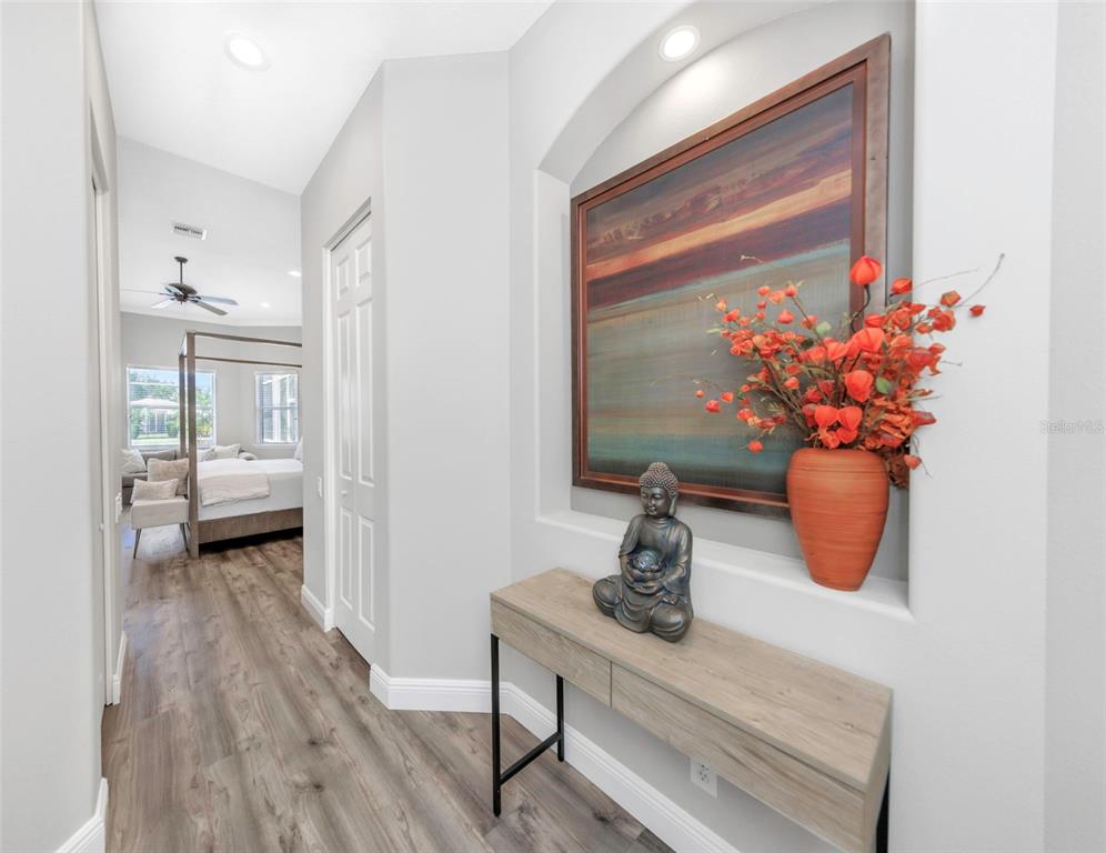 3716 Janus Way Palm Harbor, FL 34685 - Photo 21 of 69 a view of living room filled with furniture and wooden floor