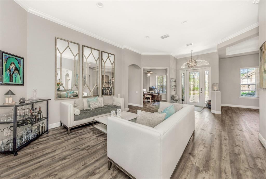 3716 Janus Way Palm Harbor, FL 34685 - Photo 5 of 69 a living room with furniture and a large window