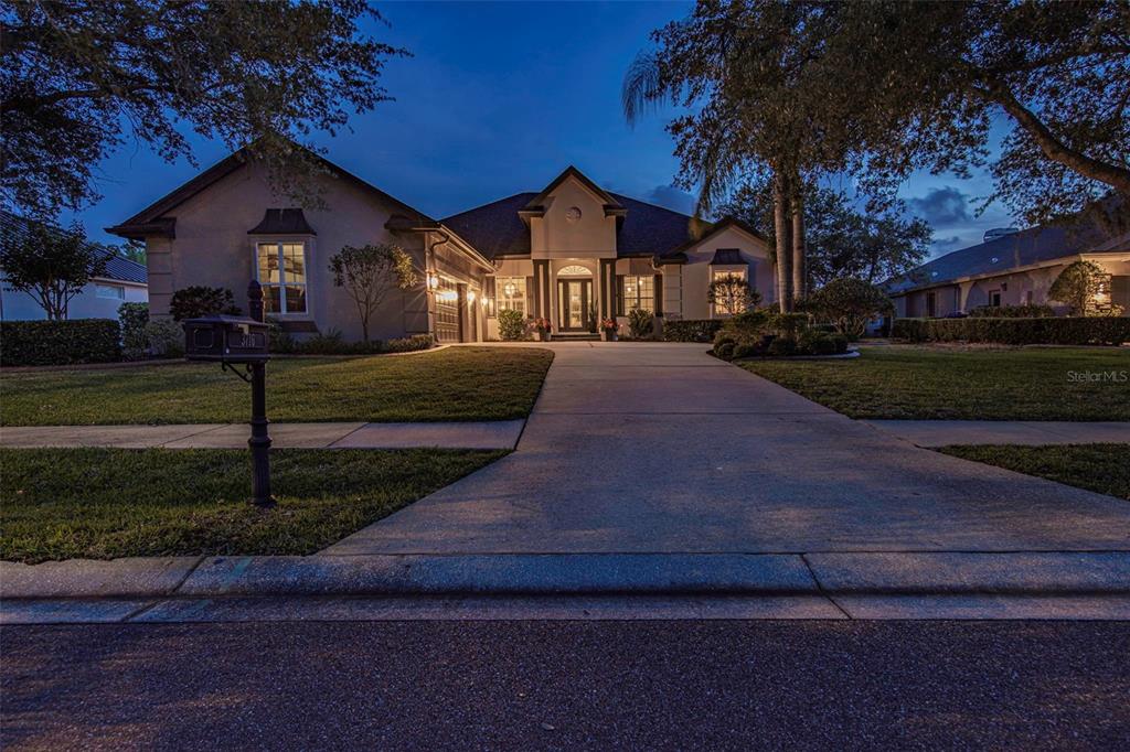 3716 Janus Way Palm Harbor, FL 34685 - Photo 60 of 69 a front view of a house with a yard