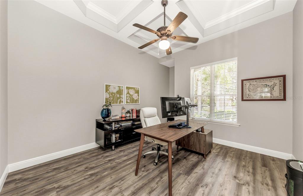 3716 Janus Way Palm Harbor, FL 34685 - Photo 9 of 69 a view of a workspace with wooden floor and a window