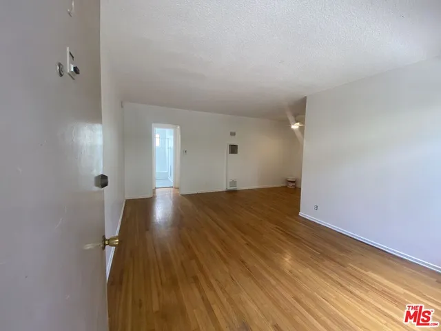 a view of livingroom with hardwood floor and hallway