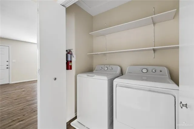 a view of a brick house with a large window and a yard