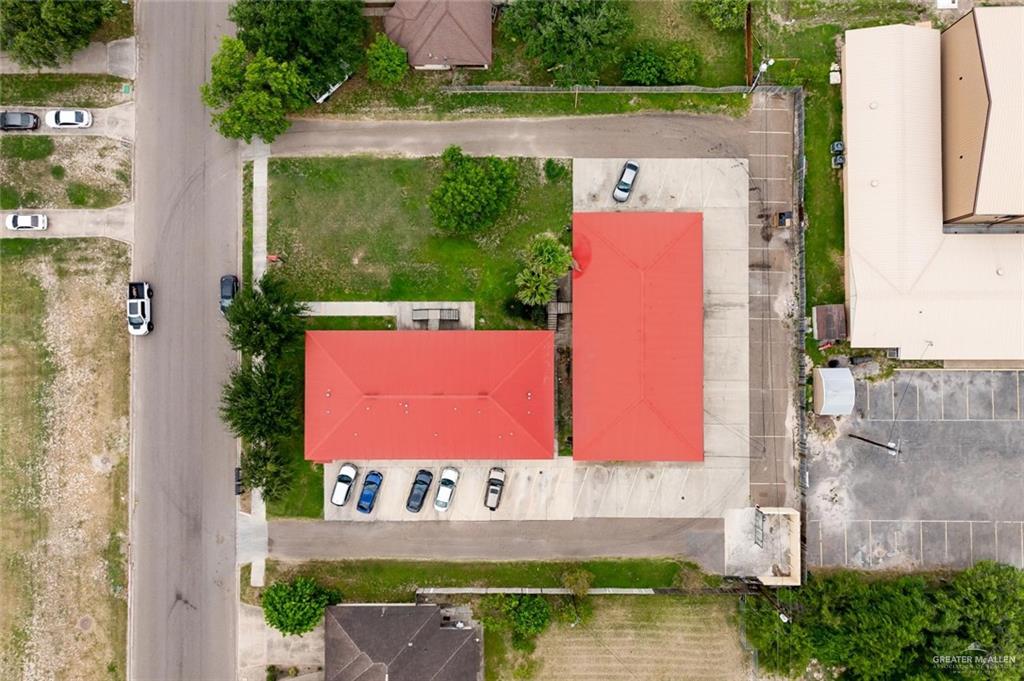 1105 West Stubbs Street, Unit 3 Edinburg, TX 78539 - Photo 12 of 15 a view of a brick house with a large window and a yard