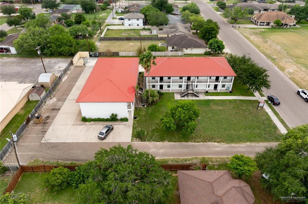 1105 West Stubbs Street, Unit 3 Edinburg, TX 78539 - Photo 14 of 15 an aerial view of a house with a yard and lake view