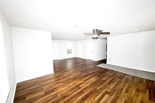 a kitchen with stainless steel appliances a stove a sink and a refrigerator