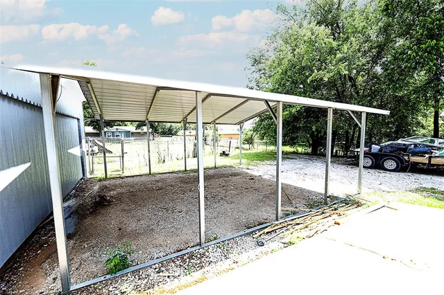 a view of a house with snow on the background