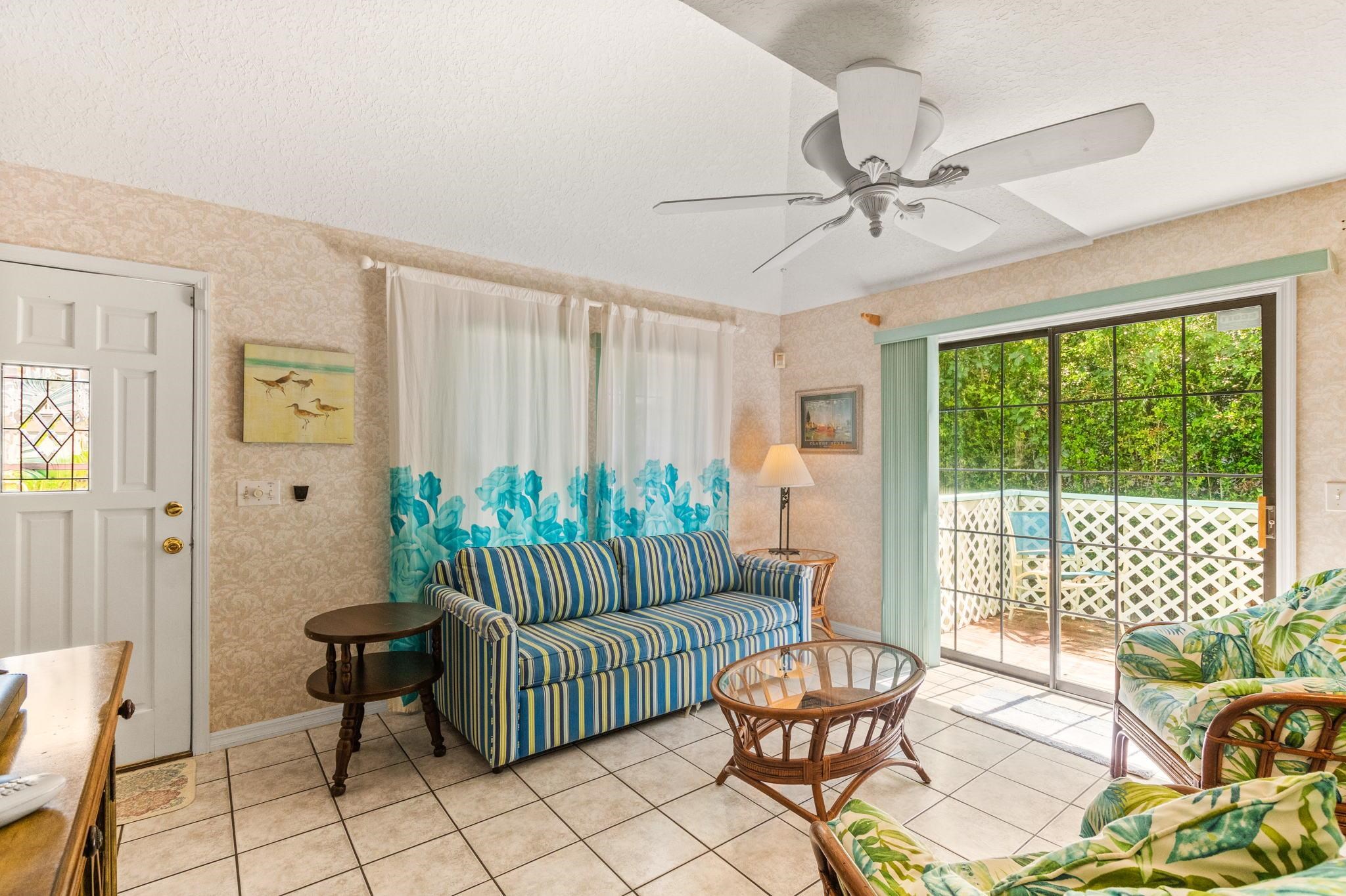 11 C Street St. Augustine, FL 32080 - Photo 11 of 40 a living room with furniture and a floor to ceiling window