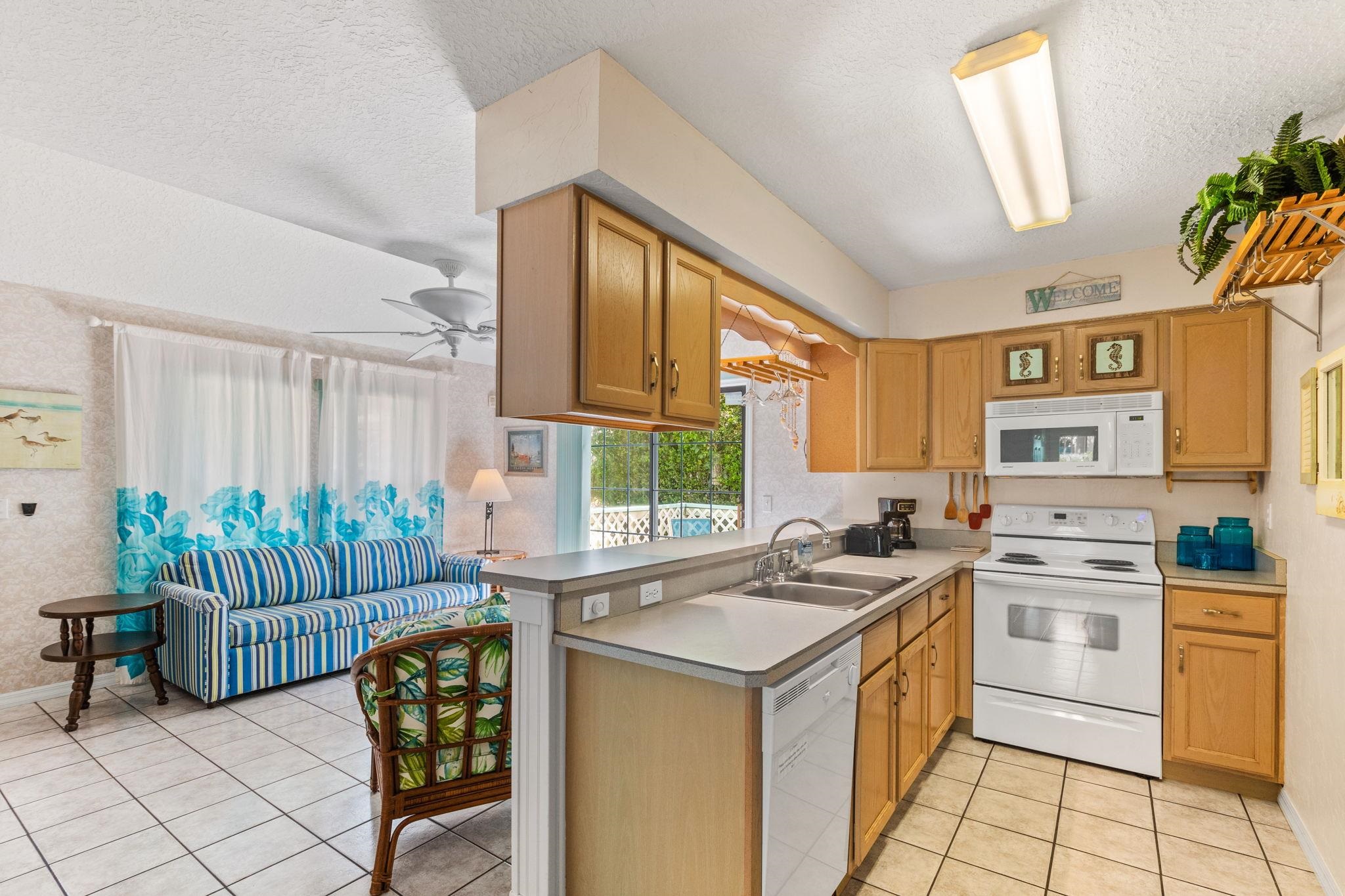 11 C Street St. Augustine, FL 32080 - Photo 12 of 40 a kitchen that has a sink and a stove top oven