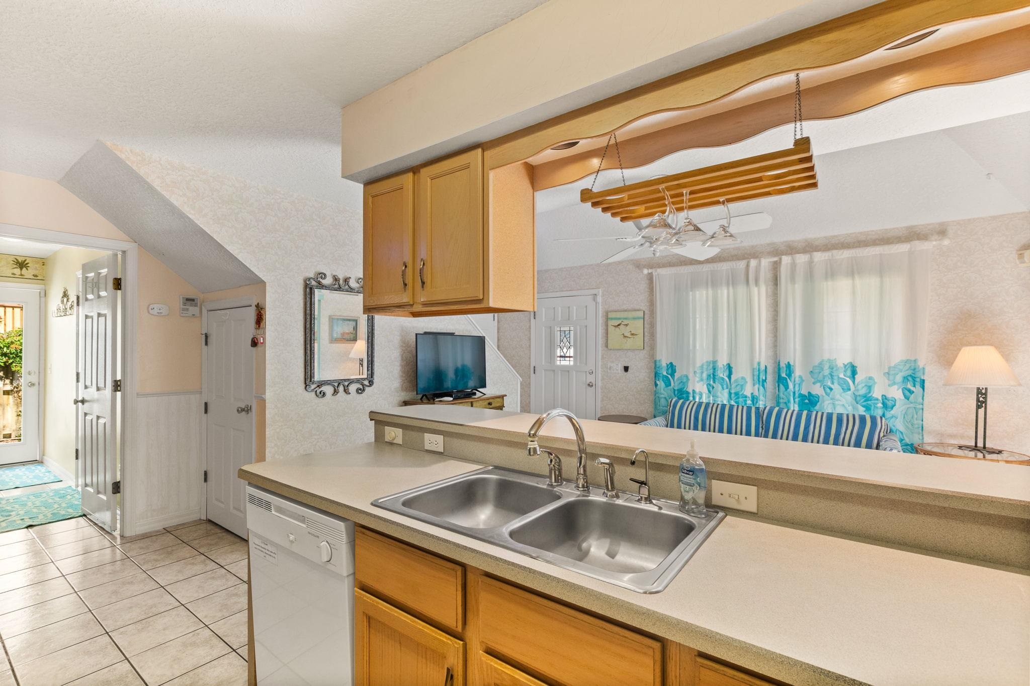 11 C Street St. Augustine, FL 32080 - Photo 13 of 40 a kitchen with a sink and a refrigerator