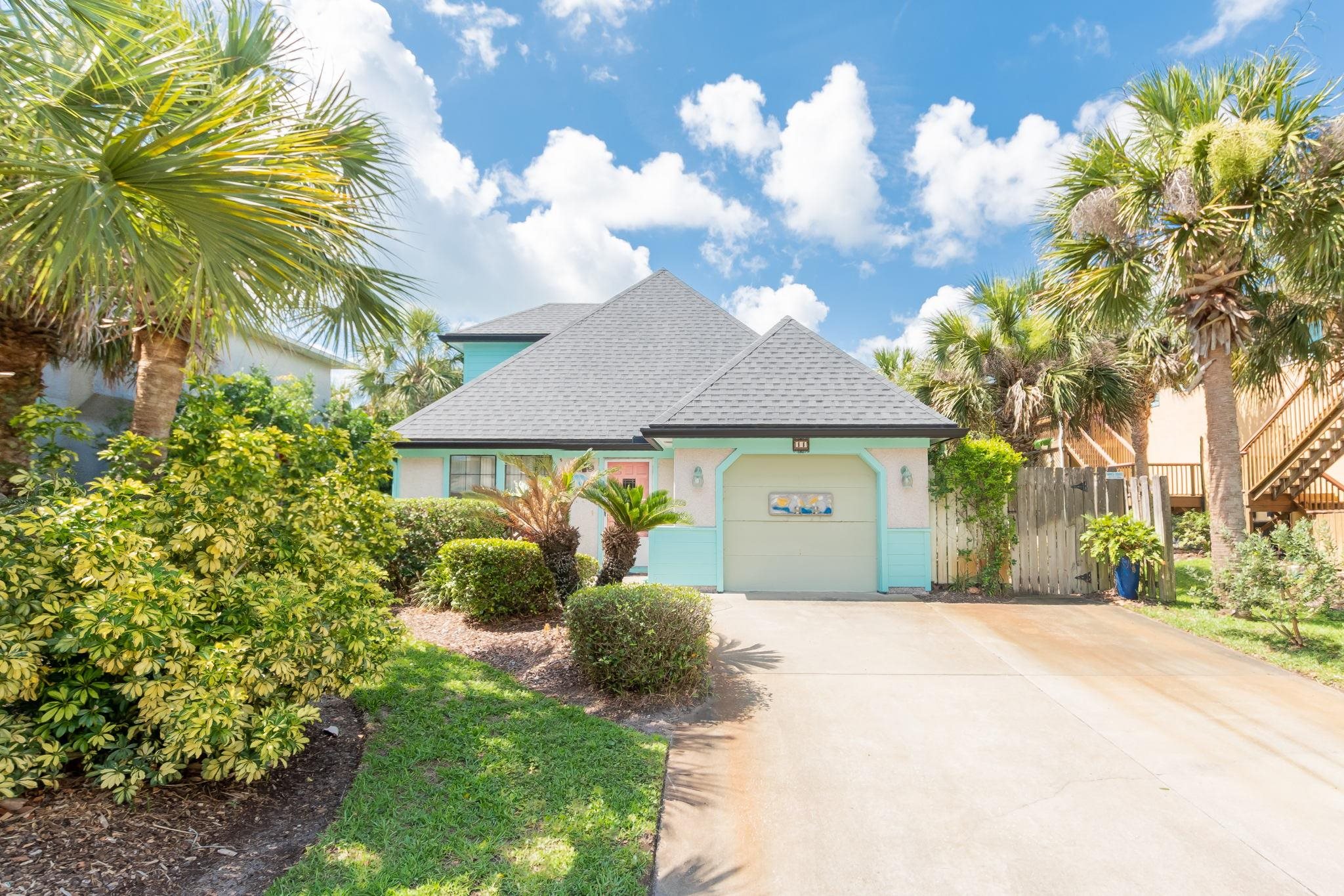 11 C Street St. Augustine, FL 32080 - Photo 2 of 40 a front view of a house with a yard and garage