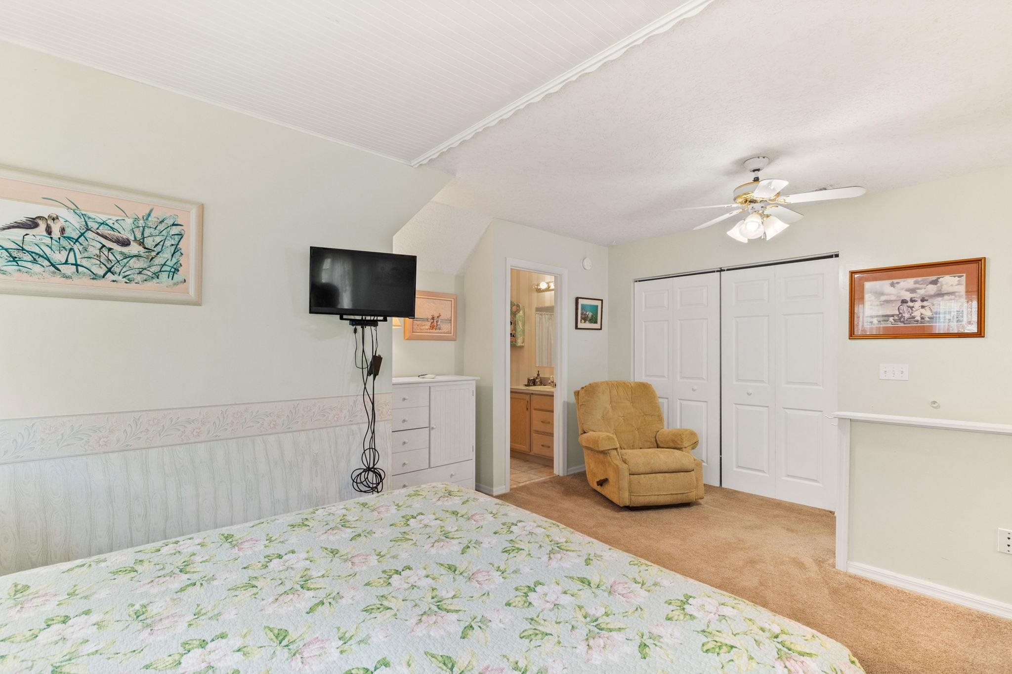 11 C Street St. Augustine, FL 32080 - Photo 27 of 40 a bedroom with a bed and a flat screen tv
