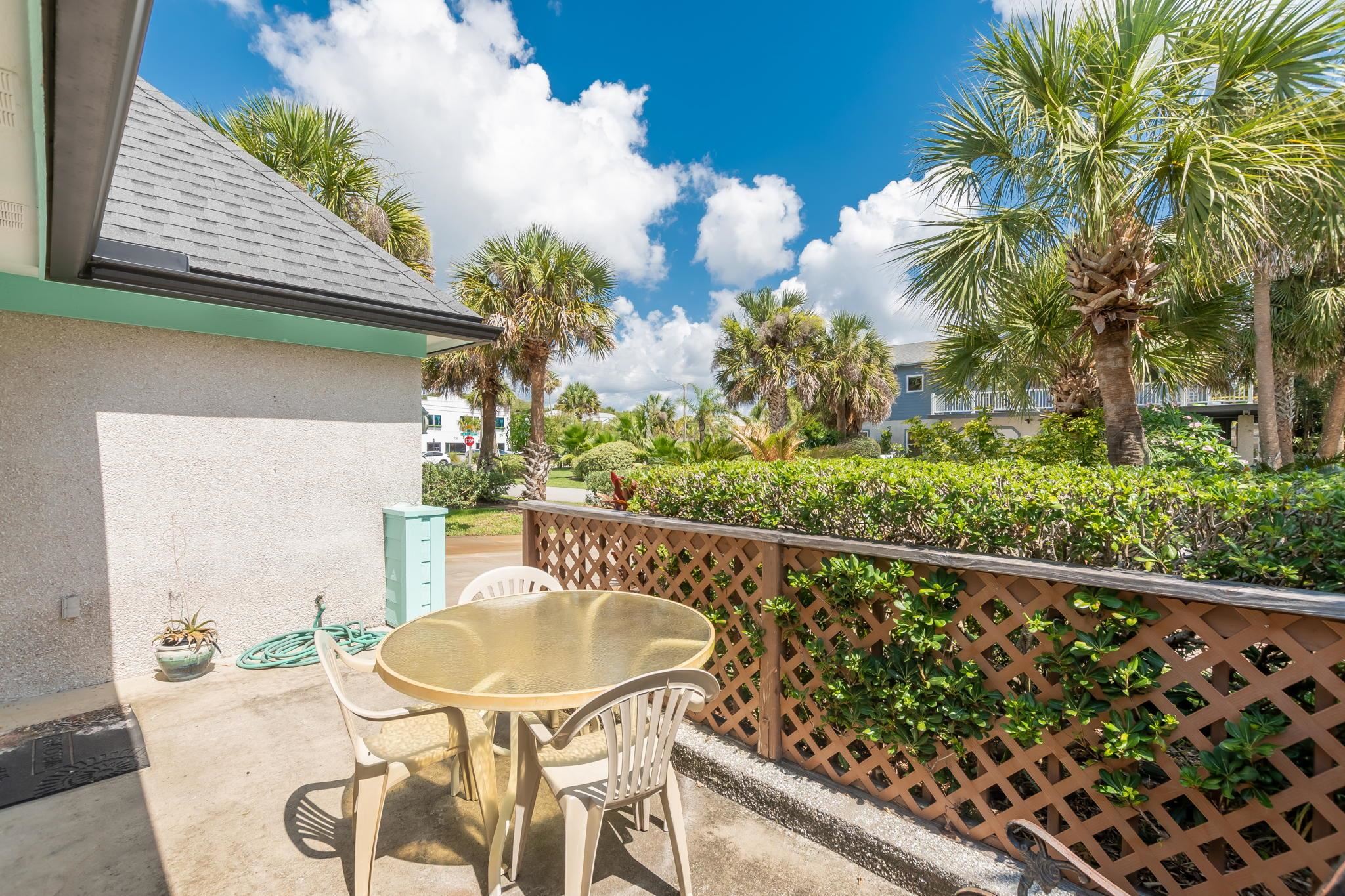 11 C Street St. Augustine, FL 32080 - Photo 36 of 40 a balcony with table and chairs and potted plants