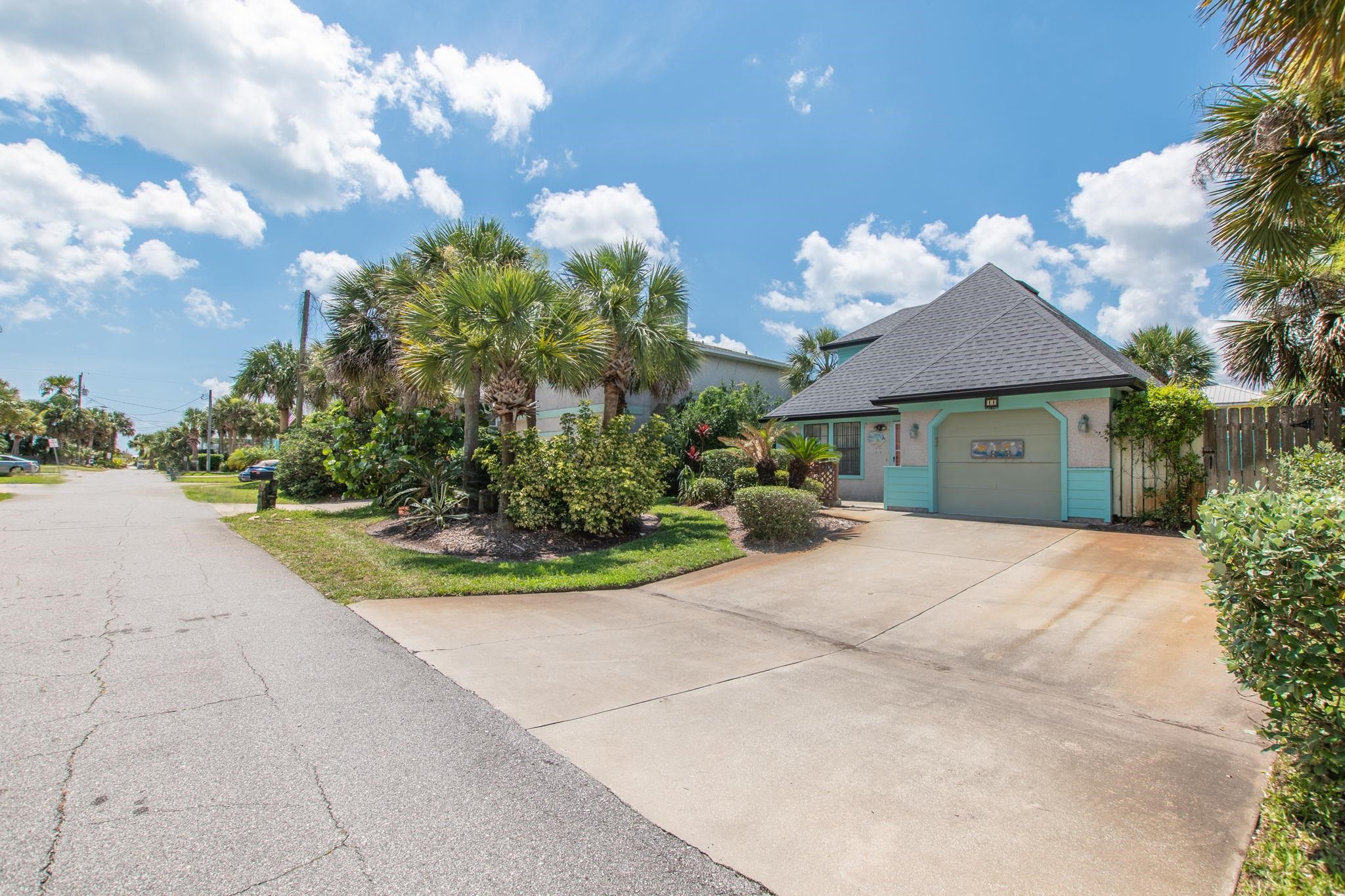 11 C Street St. Augustine, FL 32080 - Photo 6 of 40 a front view of a house with a yard and garage