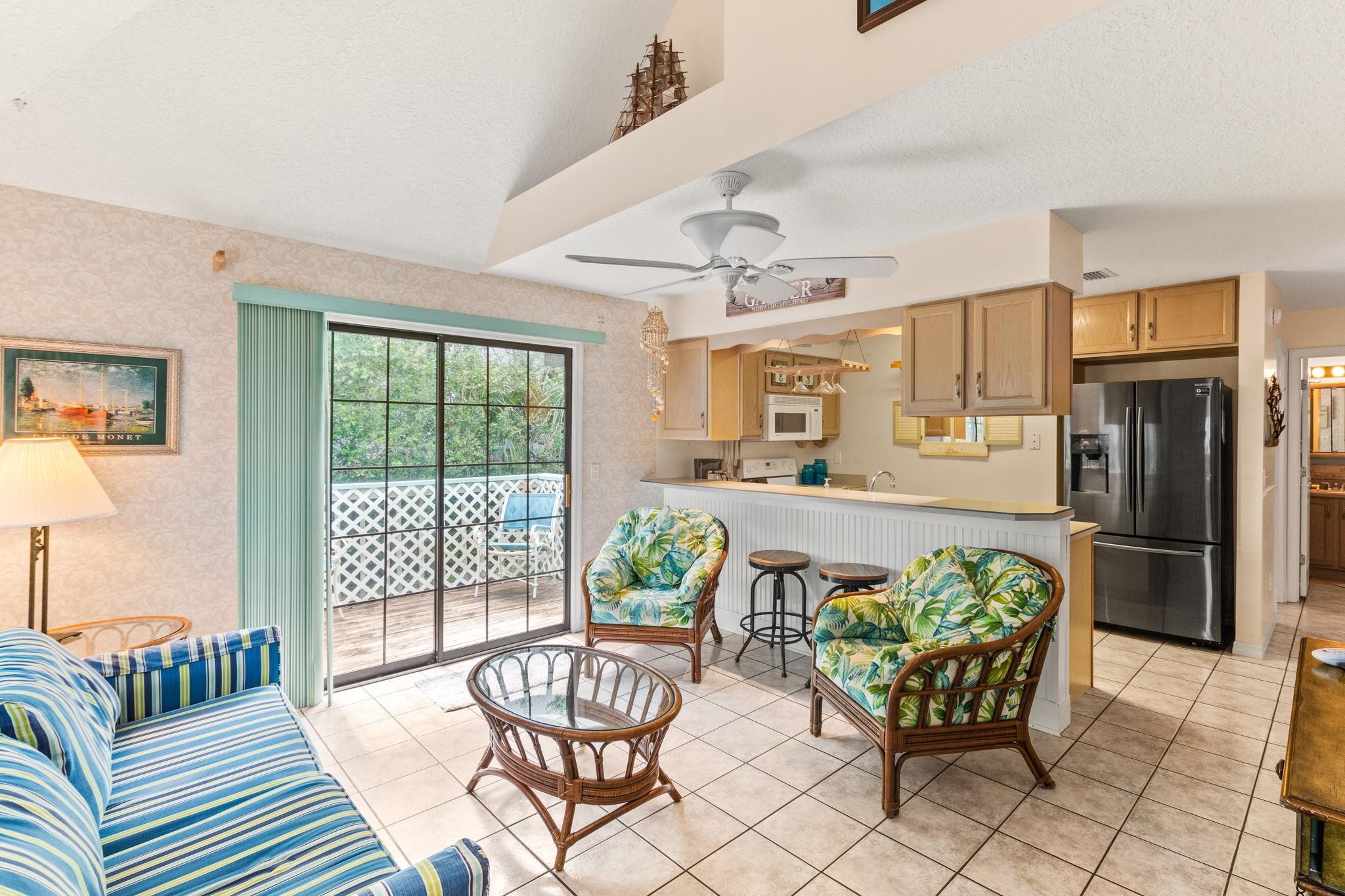 11 C Street St. Augustine, FL 32080 - Photo 9 of 40 a living room with furniture and a floor to ceiling window