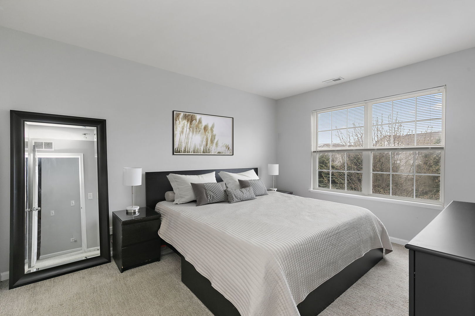259 Comstock Drive Elgin, IL 60124 - Photo 13 of 15 a bedroom with bed and a window