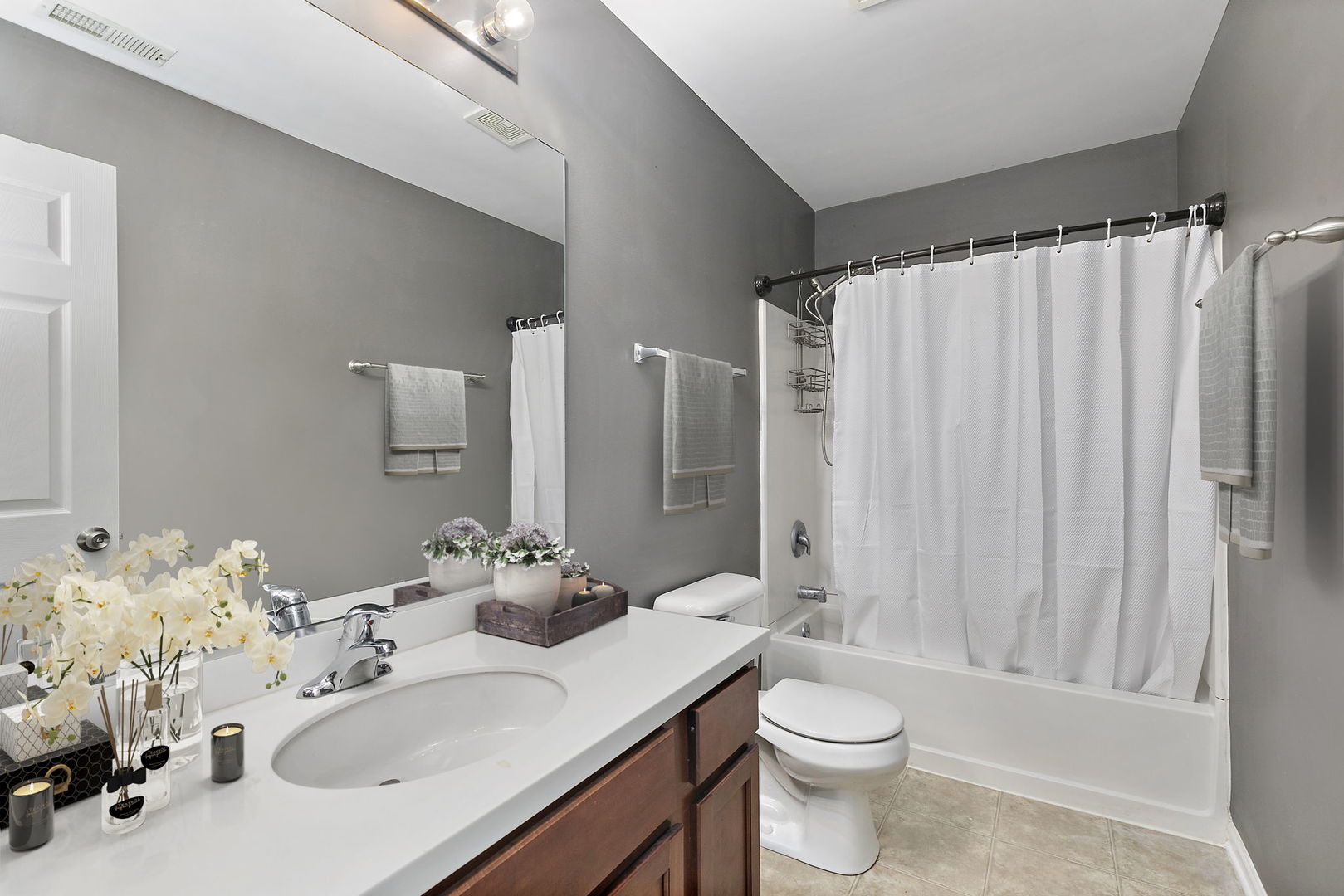 259 Comstock Drive Elgin, IL 60124 - Photo 14 of 15 a bathroom with a sink vanity mirror and toilet