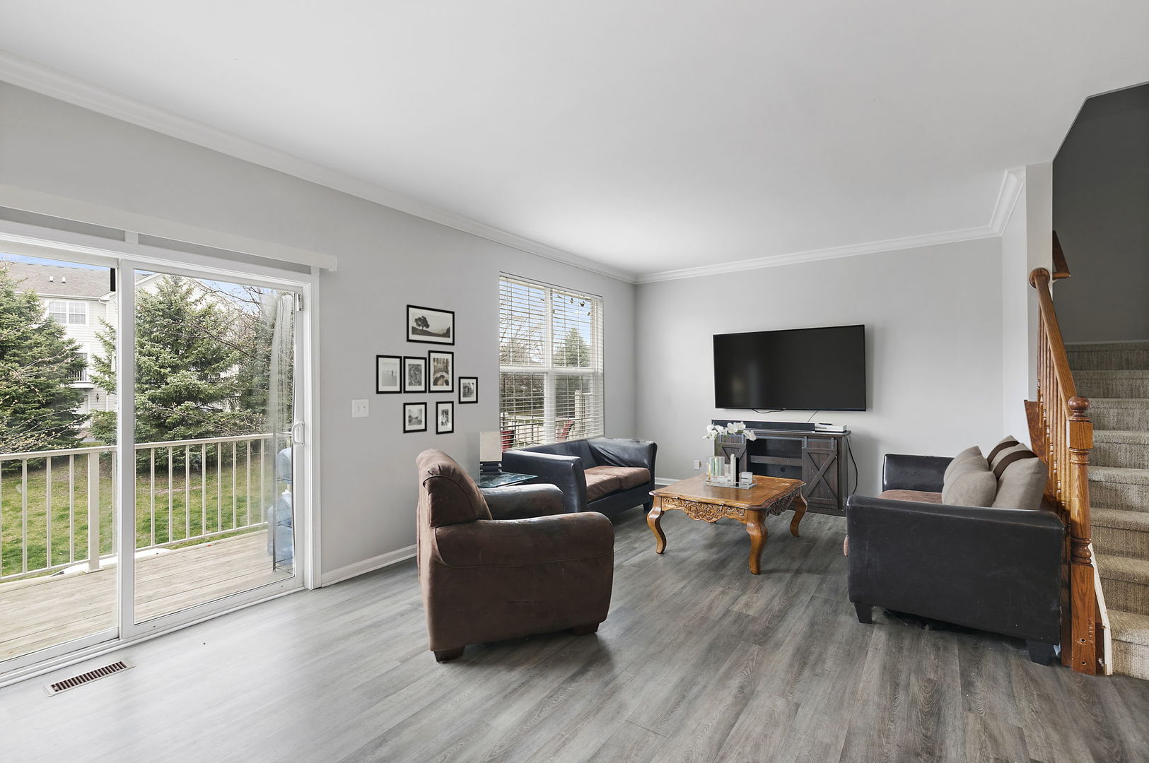 259 Comstock Drive Elgin, IL 60124 - Photo 6 of 15 a living room with furniture a flat screen tv and a large window