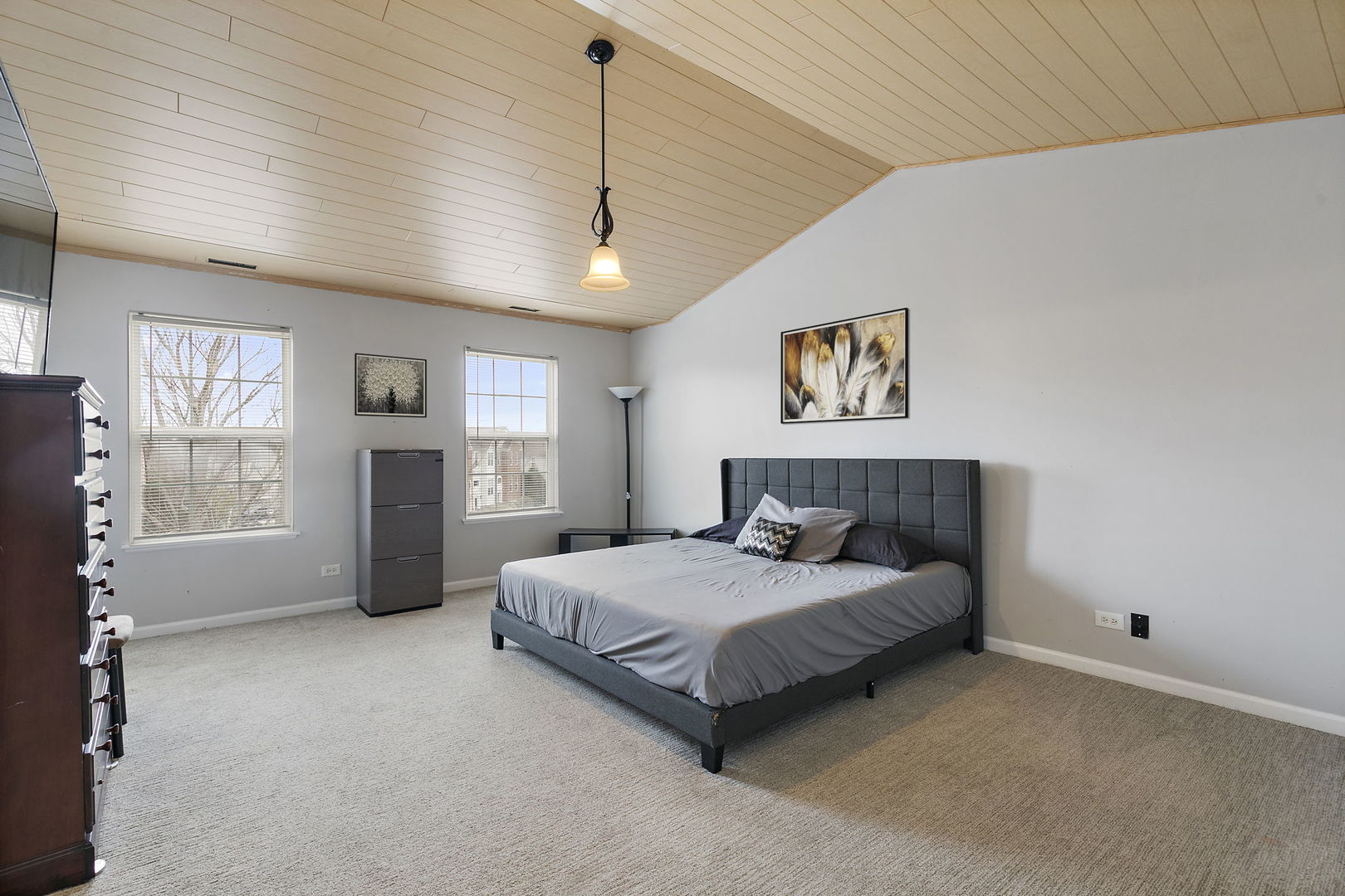 259 Comstock Drive Elgin, IL 60124 - Photo 9 of 15 a spacious bedroom with a large bed and a window