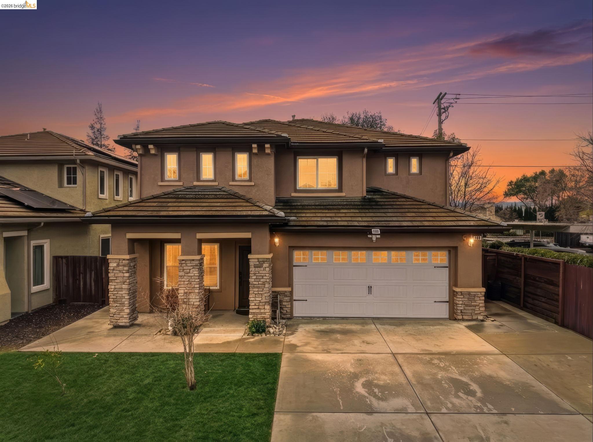 104 Genoa Way Oakley, CA 94561 - Photo 1 of 1 a front view of a house with a yard