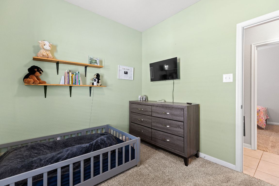 241 El Dorado Road Jarrell, TX 76537 - Photo 12 of 26 a room with furniture and a flat screen tv