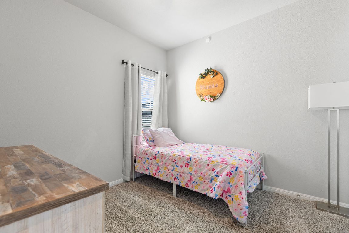 241 El Dorado Road Jarrell, TX 76537 - Photo 14 of 26 a bedroom with a bed and a window