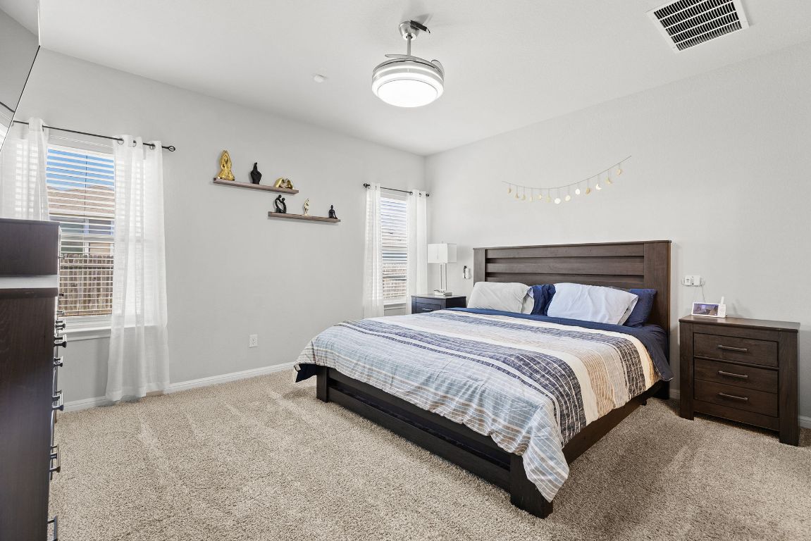 241 El Dorado Road Jarrell, TX 76537 - Photo 17 of 26 a bedroom with a bed and with chair