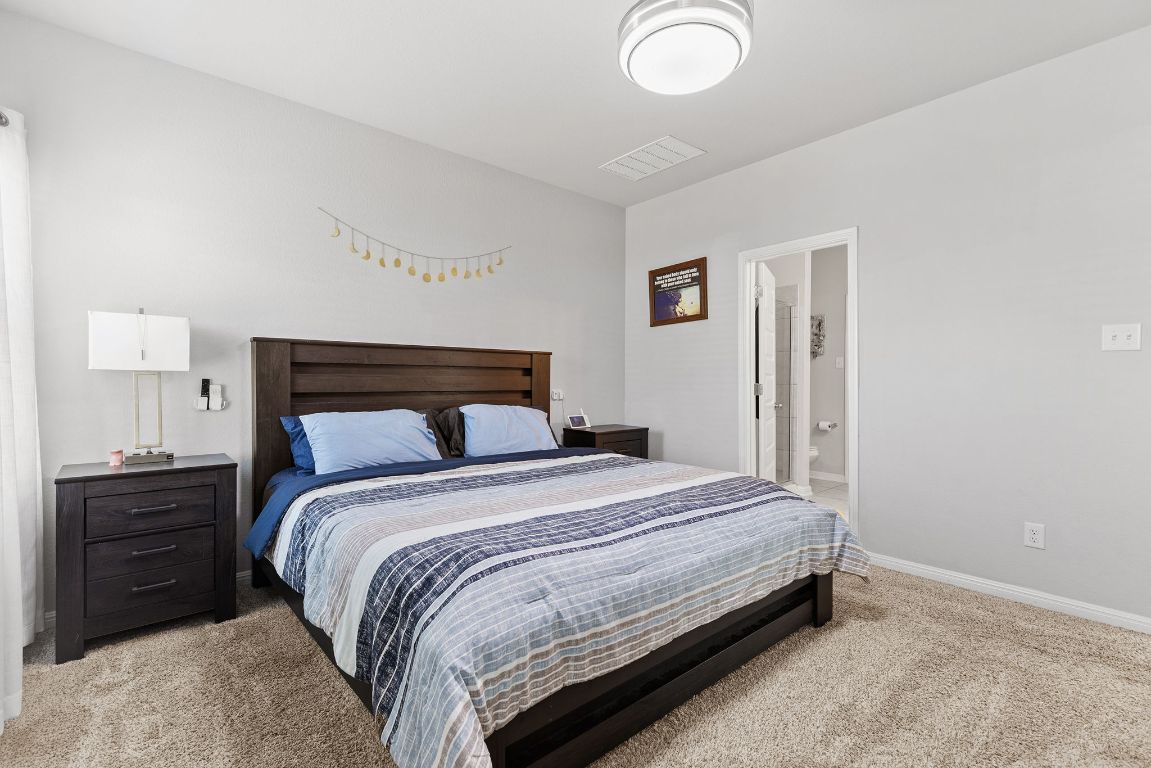 241 El Dorado Road Jarrell, TX 76537 - Photo 18 of 26 a bedroom with a bed and dresser