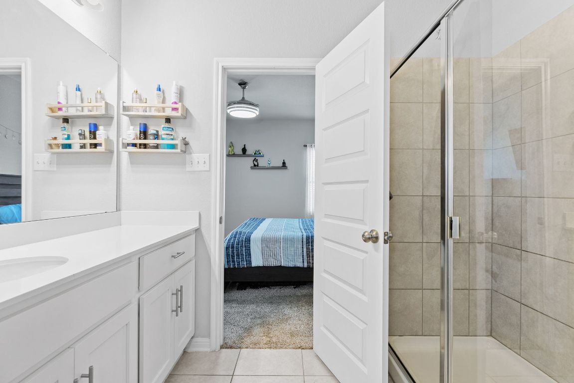 241 El Dorado Road Jarrell, TX 76537 - Photo 21 of 26 a bathroom with a sink toilet and shower