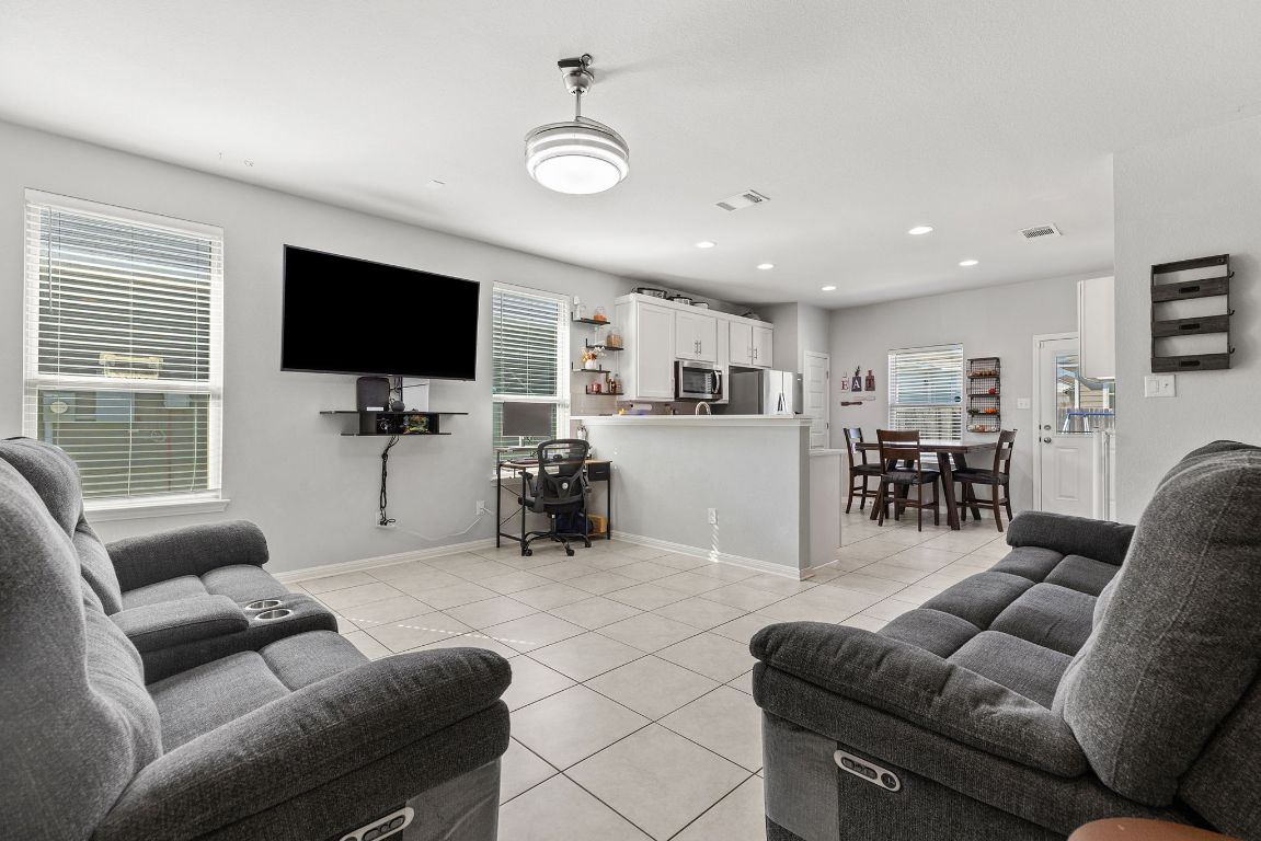 241 El Dorado Road Jarrell, TX 76537 - Photo 6 of 26 a living room with furniture and a flat screen tv