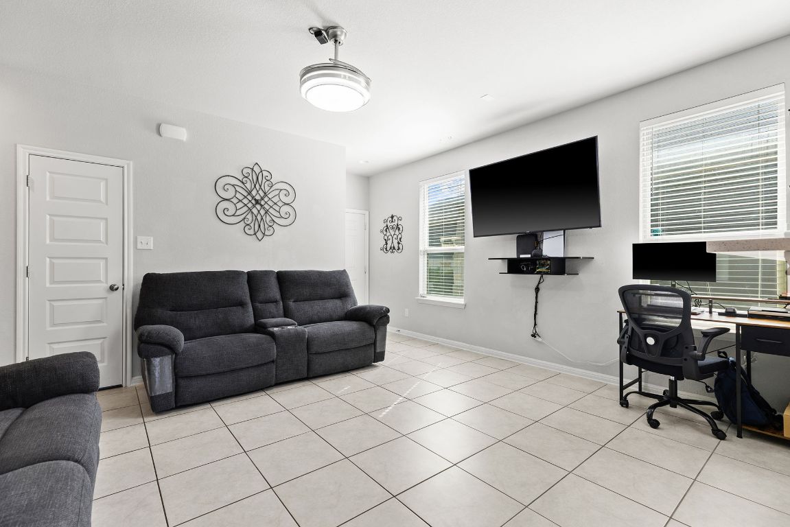 241 El Dorado Road Jarrell, TX 76537 - Photo 7 of 26 a living room with furniture and a flat screen tv
