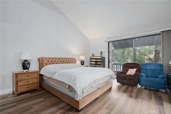 a bedroom with a bed and a couch