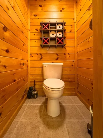 a view of a porch with wooden floor and furniture