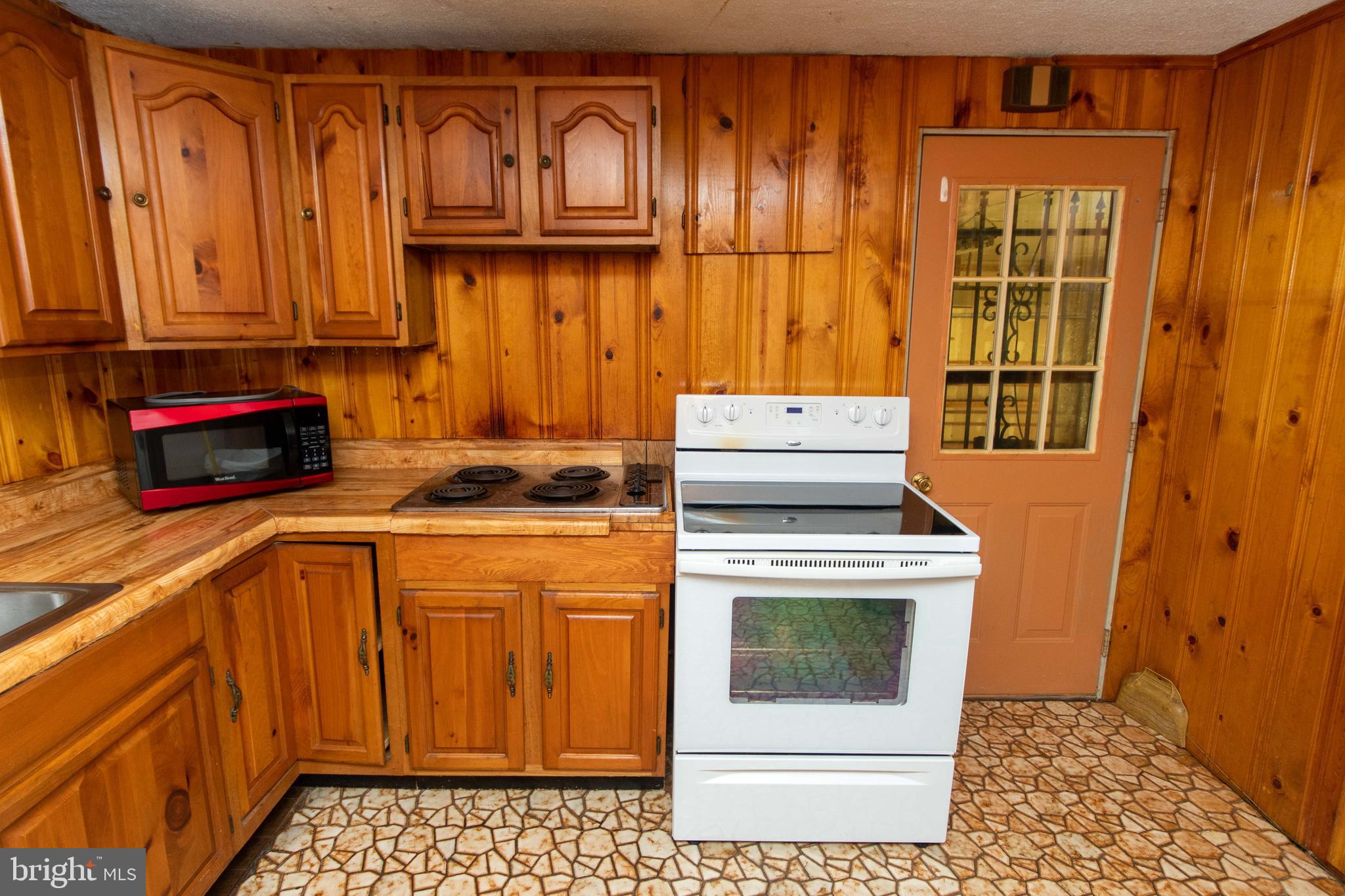 3134 James Run Road Churchville, MD 21028 - Photo 17 of 46 Electric stove/oven and door to garage