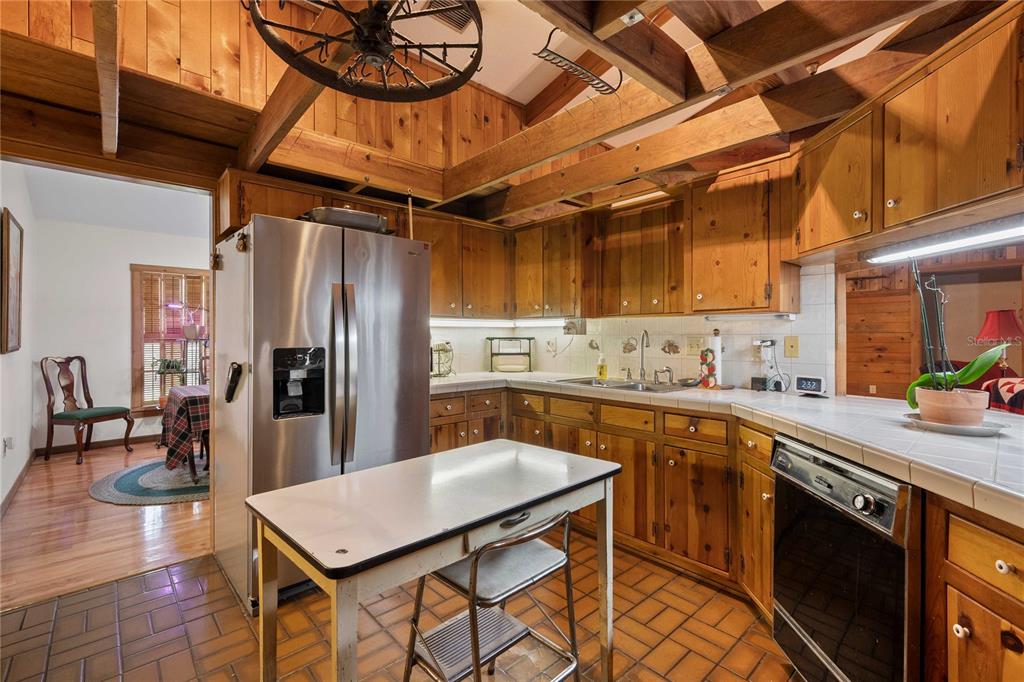17055 Sweetwater Road Dade City, FL 33523 - Photo 19 of 53 a kitchen with stainless steel appliances granite countertop a sink a stove and refrigerator