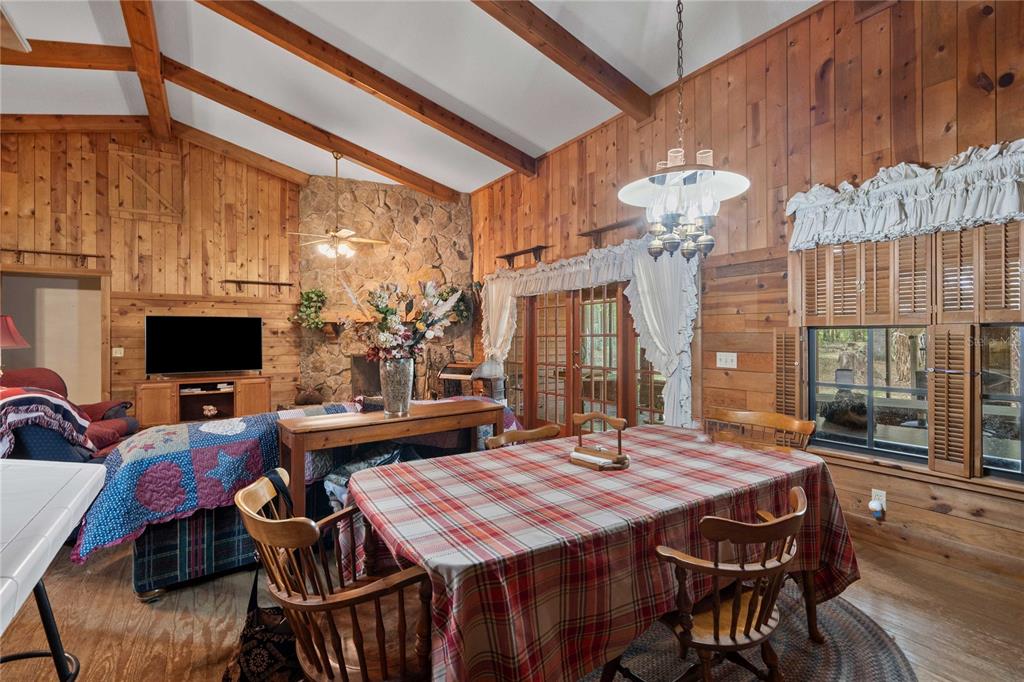 17055 Sweetwater Road Dade City, FL 33523 - Photo 26 of 53 a view of a dining room with furniture window and wooden floor