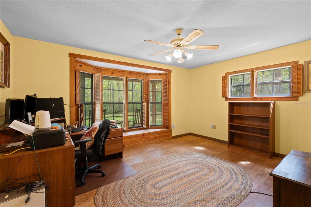 17055 Sweetwater Road Dade City, FL 33523 - Photo 34 of 53 a view of workspace with furniture and window
