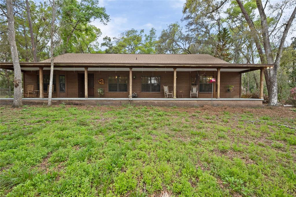 17055 Sweetwater Road Dade City, FL 33523 - Photo 8 of 53 front view of house with a yard
