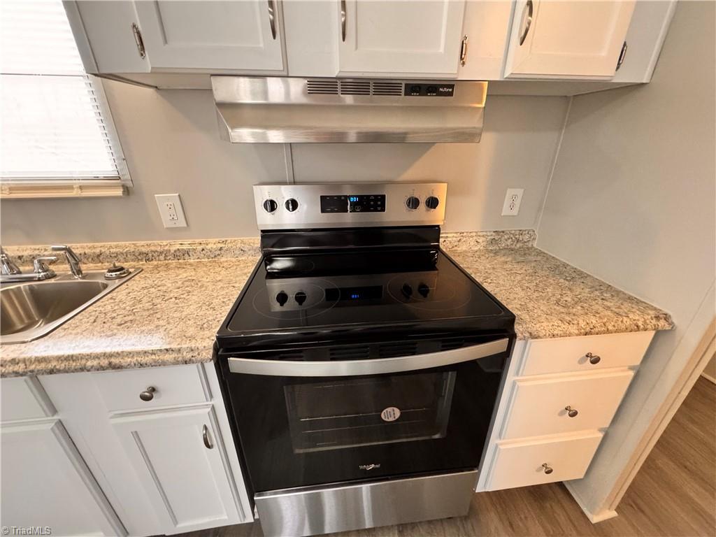 8405 Alda Road Stokesdale, NC 27357 - Photo 14 of 47 New stainless steel stove and hood vent