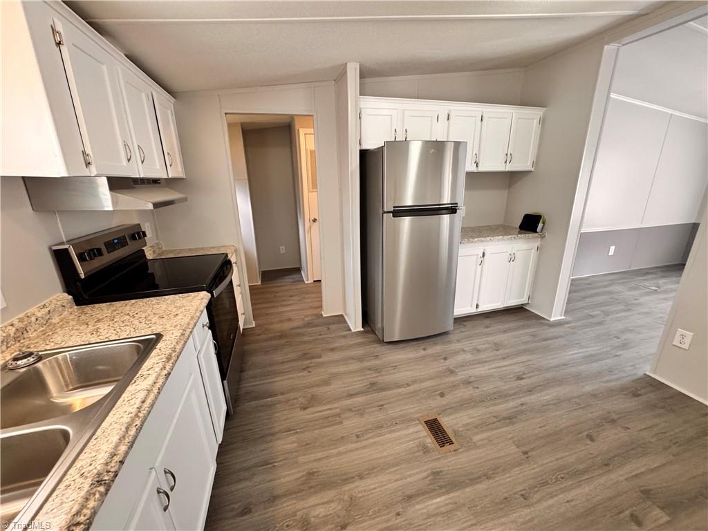 8405 Alda Road Stokesdale, NC 27357 - Photo 18 of 47 All floors throughout are new waterproof laminate