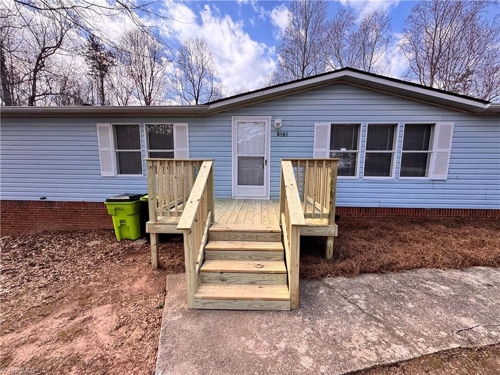 8405 Alda Road Stokesdale, NC 27357 - Photo 2 of 47 New front porch with concrete walkway to the paved driveway