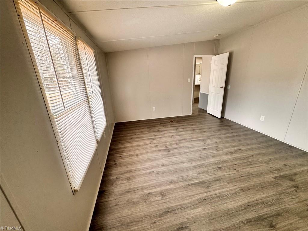 8405 Alda Road Stokesdale, NC 27357 - Photo 26 of 47 Primary bedroom has lots of natural light
