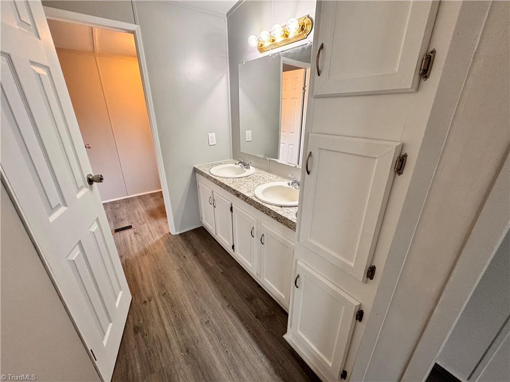 8405 Alda Road Stokesdale, NC 27357 - Photo 30 of 47 Primary ensuite bath includes a linen closet