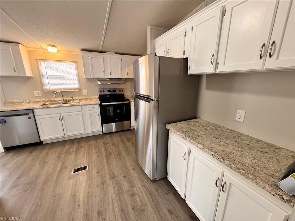 8405 Alda Road Stokesdale, NC 27357 - Photo 8 of 47 Kitchen has new countertops and appliances