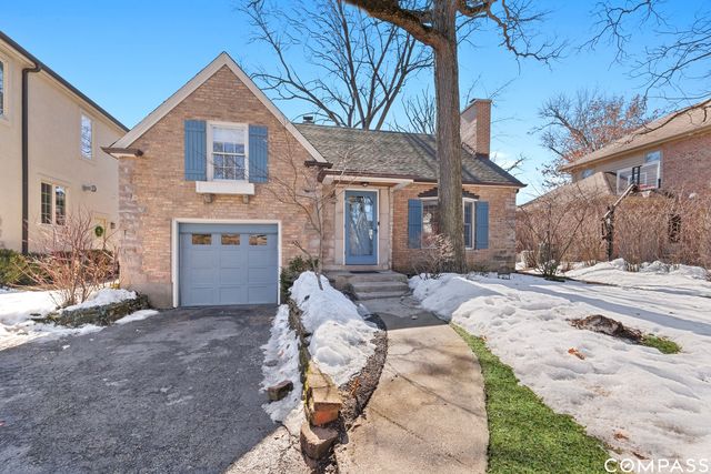 a view of a house with couches chairs and a fire pit