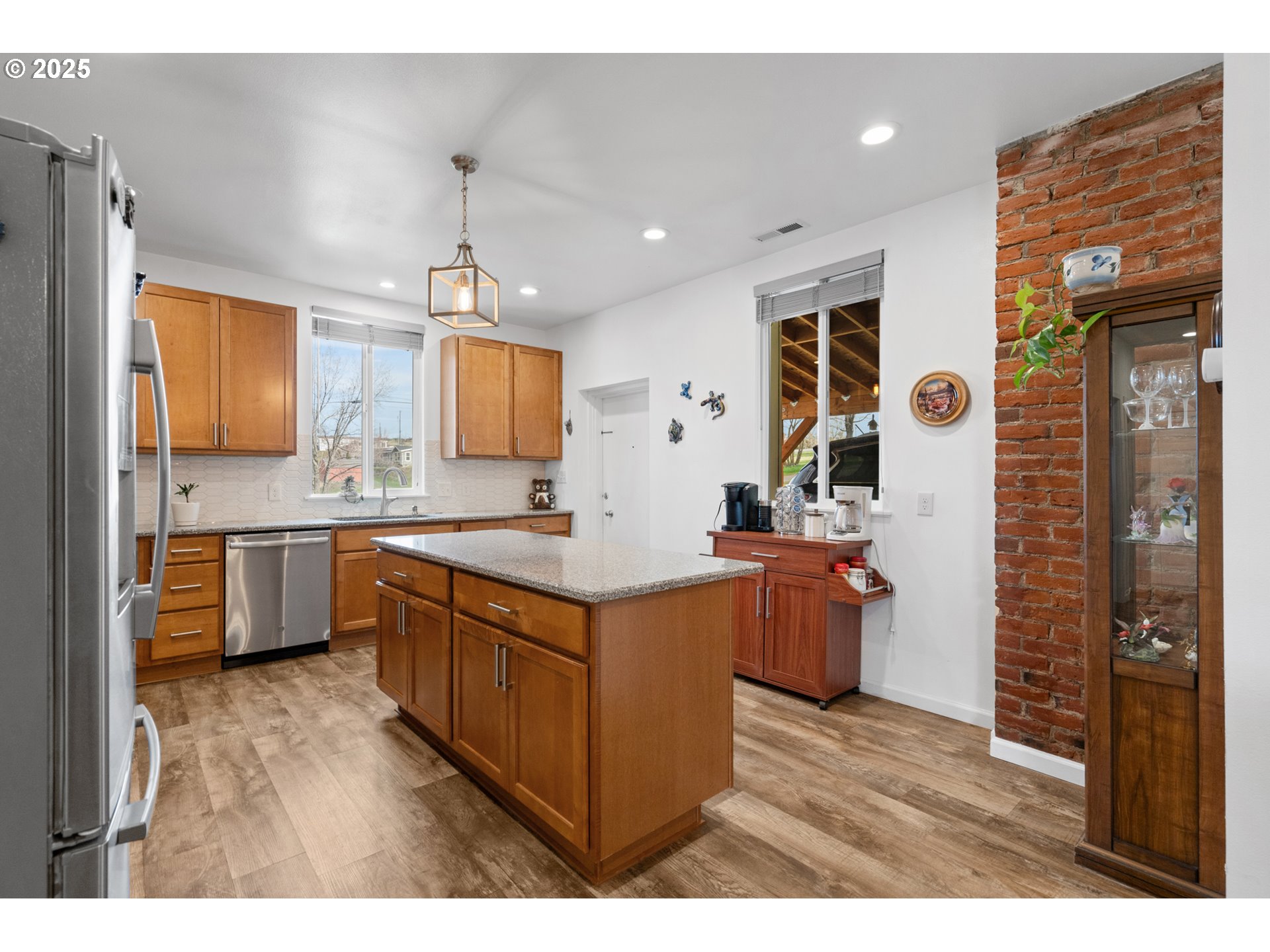 402 East Main Street Weston, OR 97886 - Photo 13 of 36 a kitchen with stainless steel appliances granite countertop a sink stove and refrigerator