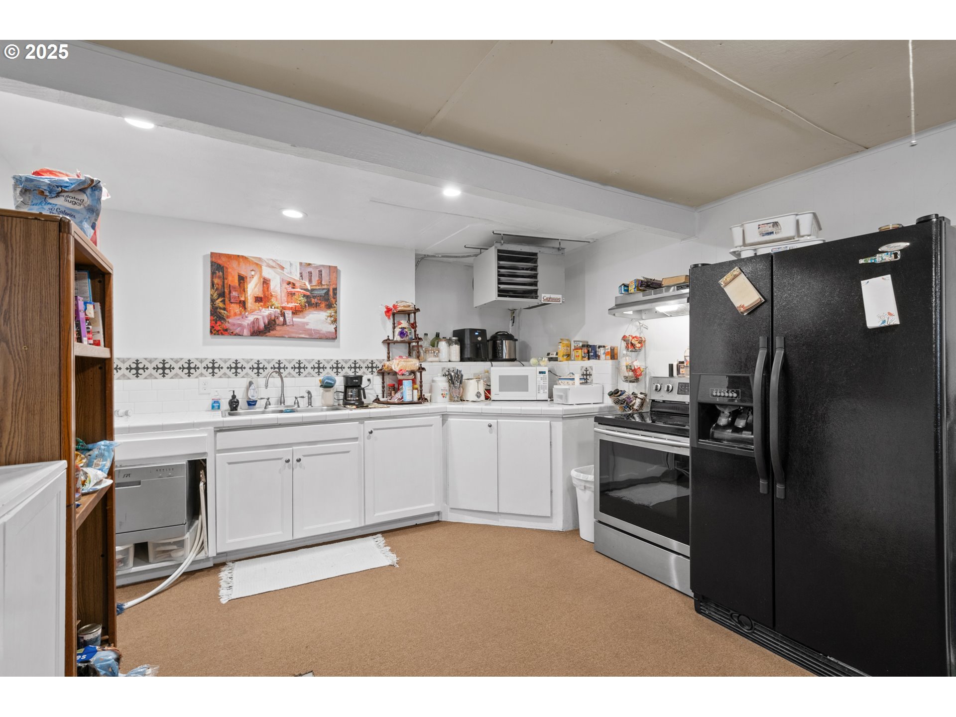 402 East Main Street Weston, OR 97886 - Photo 30 of 36 a kitchen with stainless steel appliances a refrigerator sink and stove