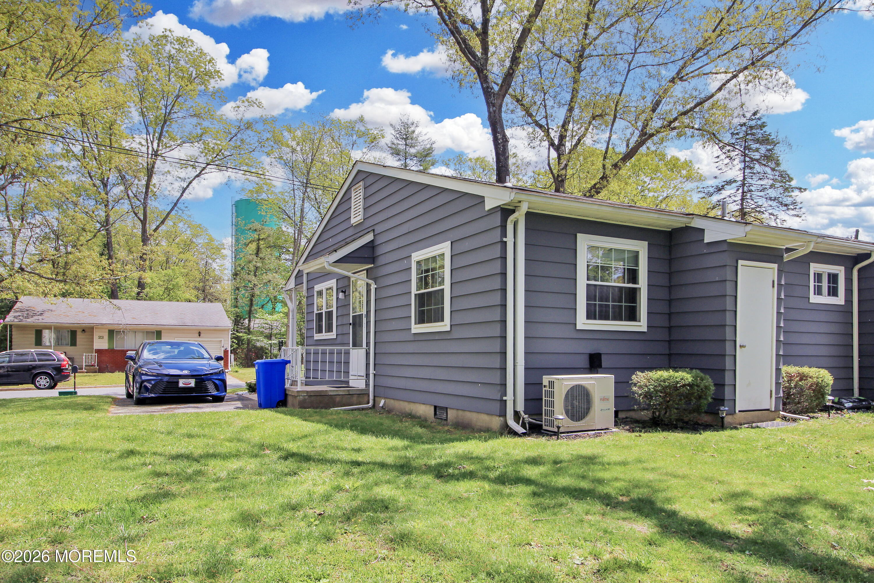 22 A Roosevelt City Road Whiting, NJ 08759 - Photo 18 of 18 a front view of a house with a yard and garage
